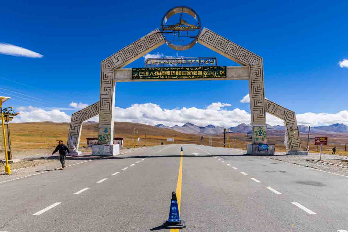 entrance gate to qomolangma national nature reserve tibet Entrance gate to Qomolangma National Nature Reserve, the protected area surrounding Mount Everest in Tibet.